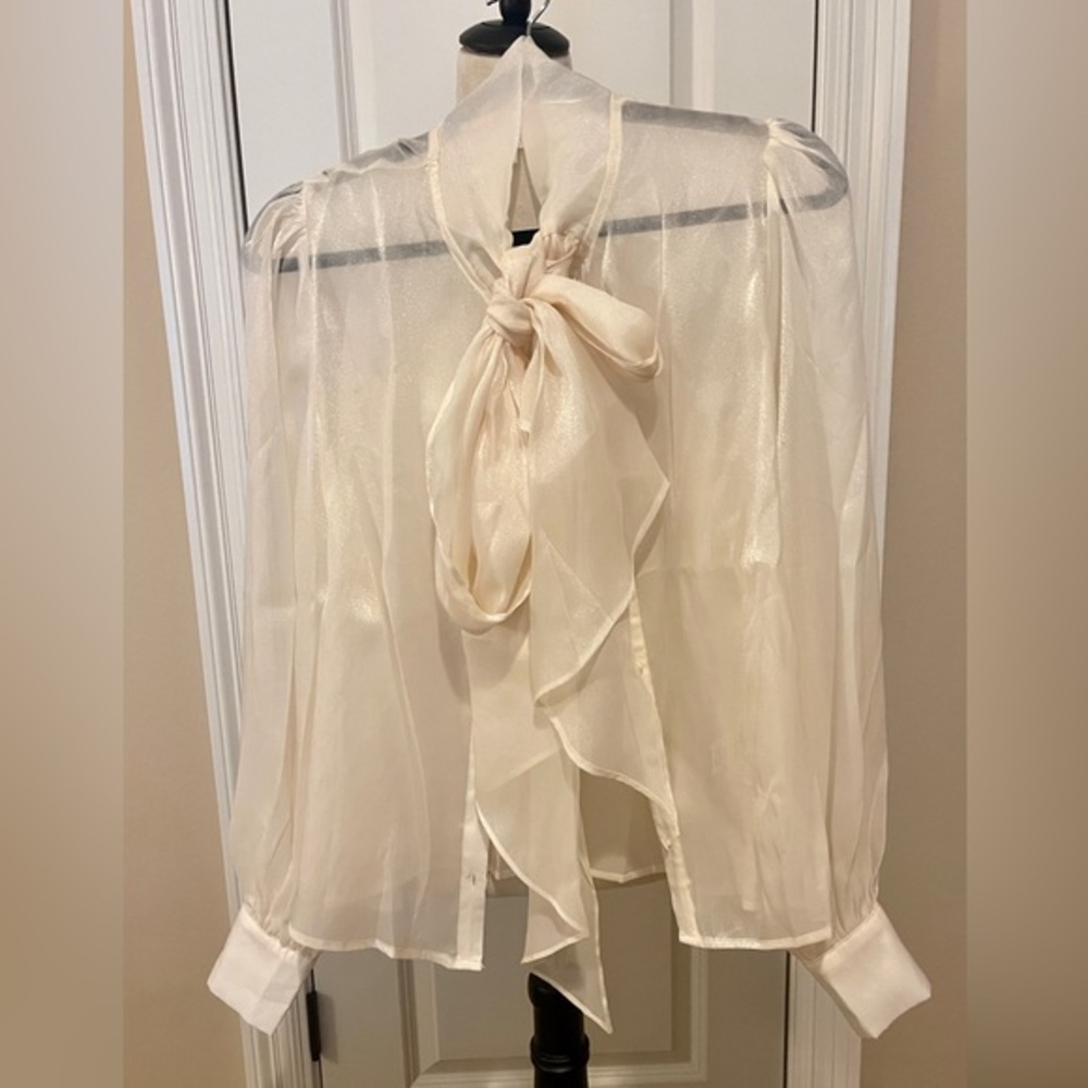 Beautiful well made off white blouse.